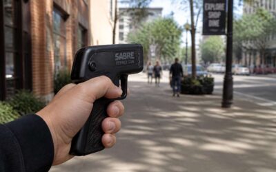 Find sabre pepper spray gun nearby for personal protection.